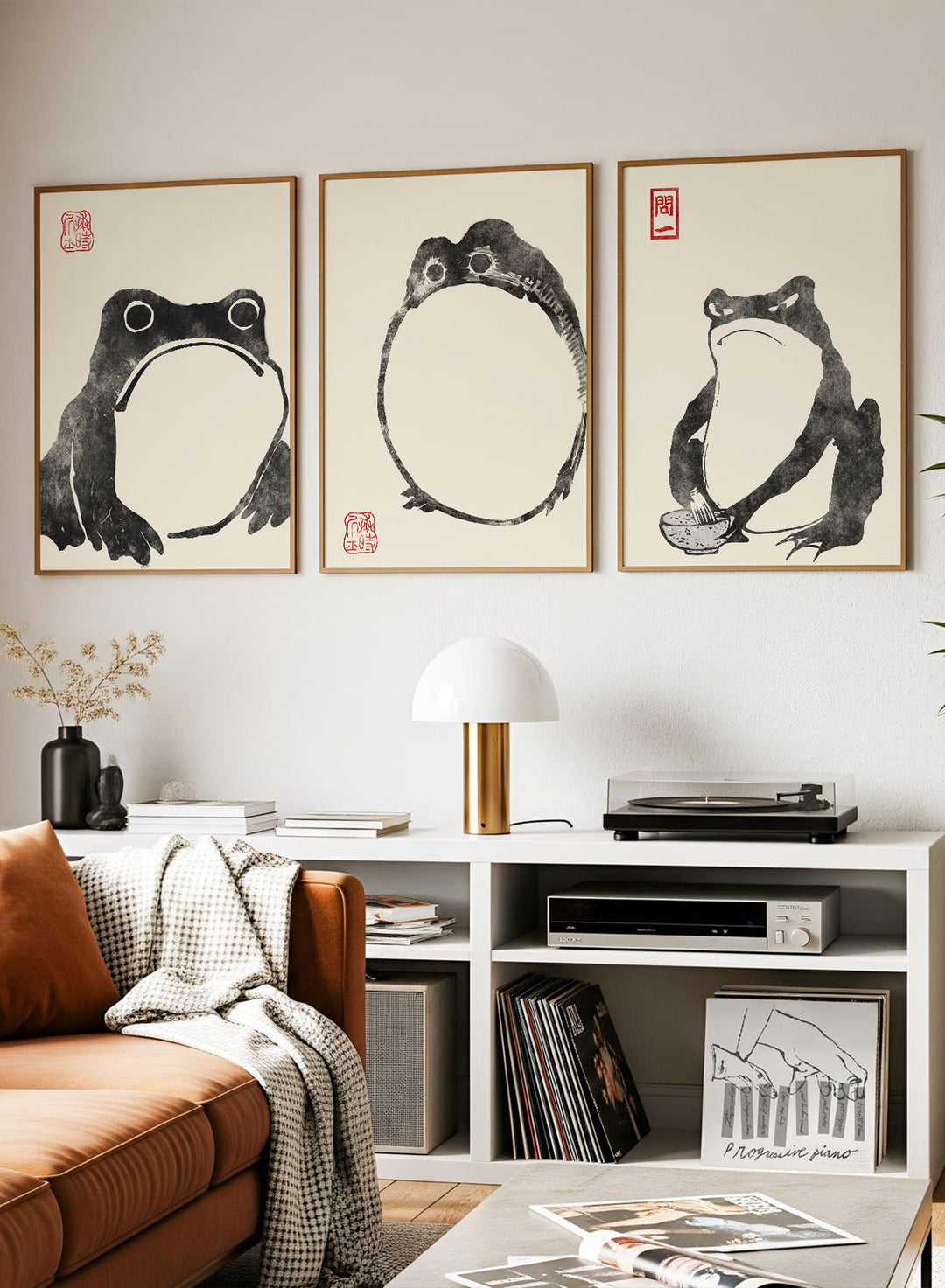 Living room with framed artwork of frogs on the wall. Matsumoto Hoji Japanese Frogs (Black) Set of 3 Art Prints_Sugar & Canvas
