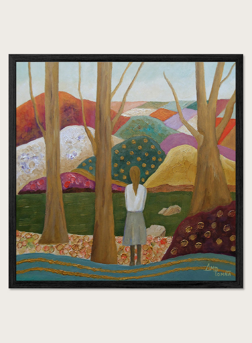 A framed landscape painting featuring a woman standing among tall trees, looking over a patchwork field of hills in earthy tones of green, purple, orange, and beige. Shop Woman Among Vibrant Hills by Angeles M. Pomata, a colorful landscape and portrait art print featuring a woman, rolling hills, trees, and earthy tones.