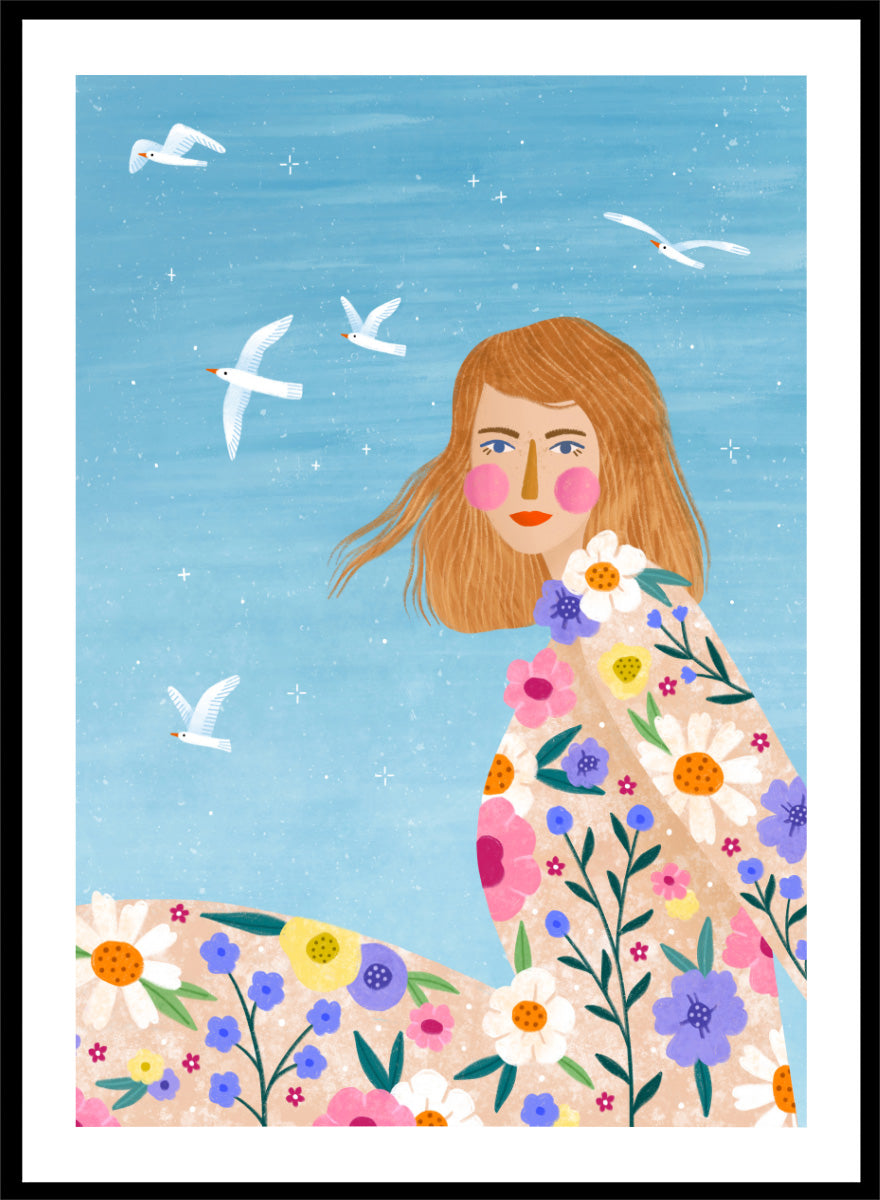 A framed art print featuring a stylized illustration of a young woman with long light brown hair, surrounded by colorful flowers and white birds against a light blue sky. ree Spirit Floral Dreams by Bea Müller floral woman art print featuring a flowing flower-covered summer dress, white birds, and a bright blue sky.