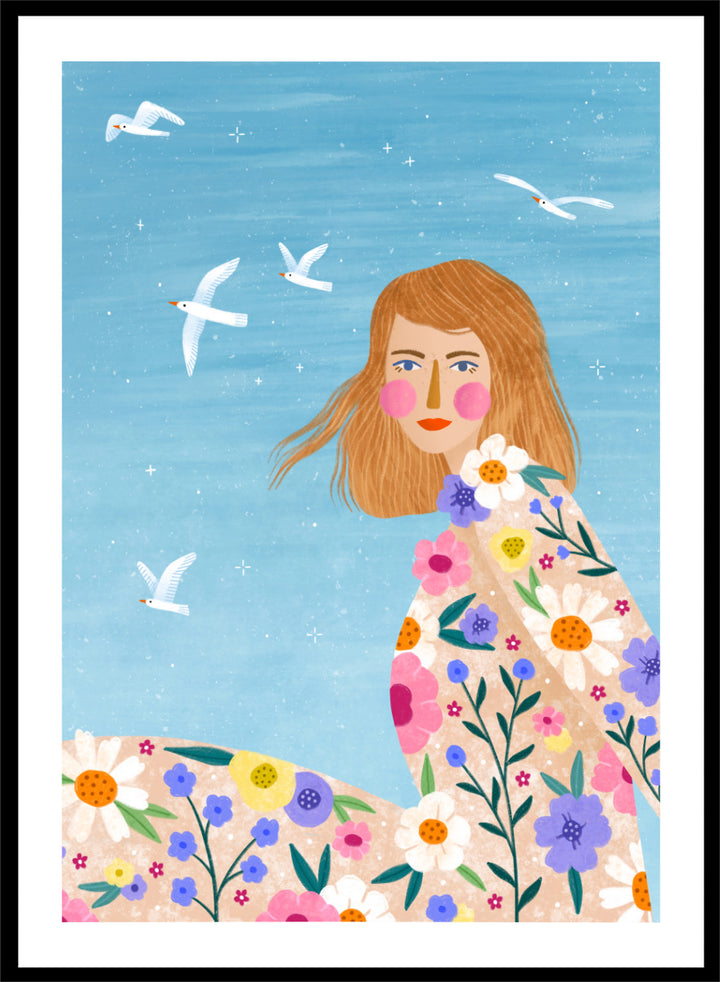 A framed art print featuring a stylized illustration of a young woman with long light brown hair, surrounded by colorful flowers and white birds against a light blue sky. ree Spirit Floral Dreams by Bea Müller floral woman art print featuring a flowing flower-covered summer dress, white birds, and a bright blue sky.