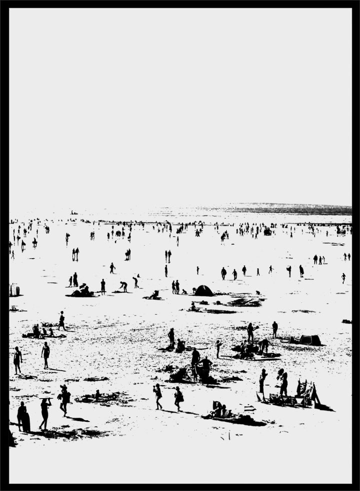 Shop Beach No.02 by Dan Hobday, a set of 2 black and white beach wall art prints posters featuring a panoramic shoreline filled with tiny figures.