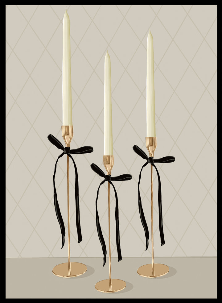Three gold taper candle holders with cream candles and black ribbon bows, arranged on a light gray surface against a beige diamond-patterned background. Elegant Gold Taper Candles by Lisa Solomoniuk premium framed fine art print featuring gold candlesticks, cream tapers, and long black ribbons.