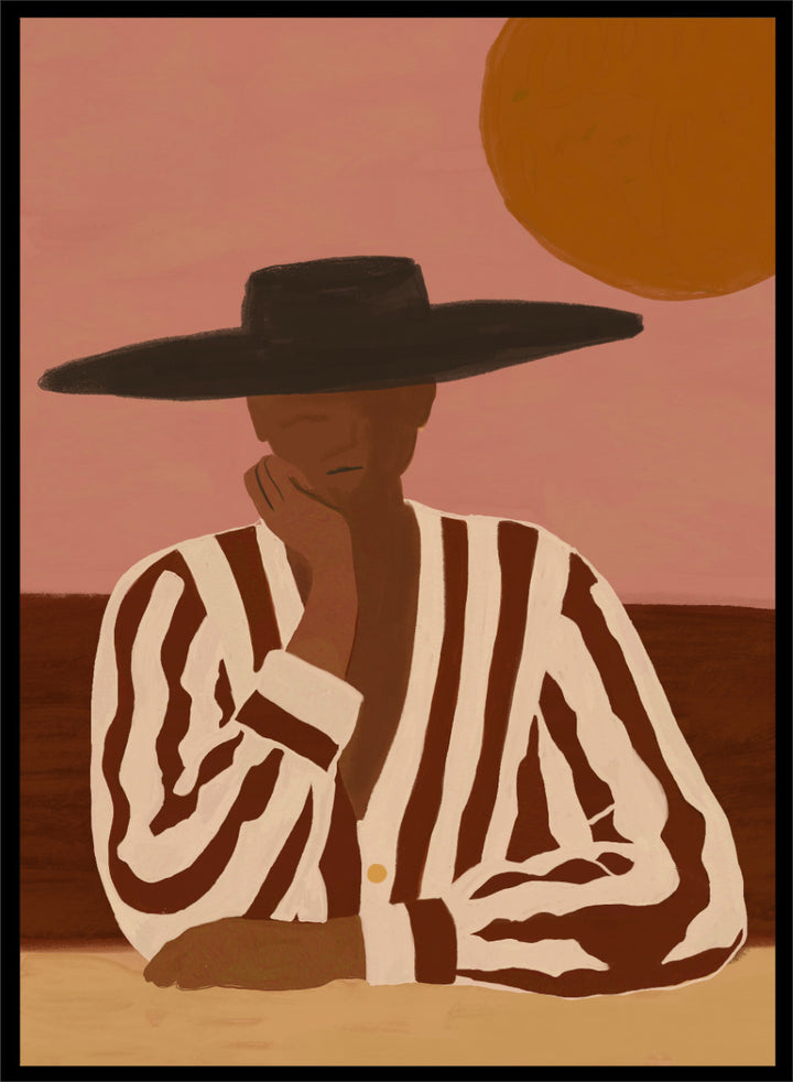 A stylized art print depicting a seated figure in a wide-brimmed black hat and a brown-and-white vertically striped shirt, set against a dusty pink sky with a large orange sun. Desert Dreamer by The Art Concept art print featuring a relaxed figure in a wide black hat, striped shirt, dusty pink sky, and warm desert-inspired tones.