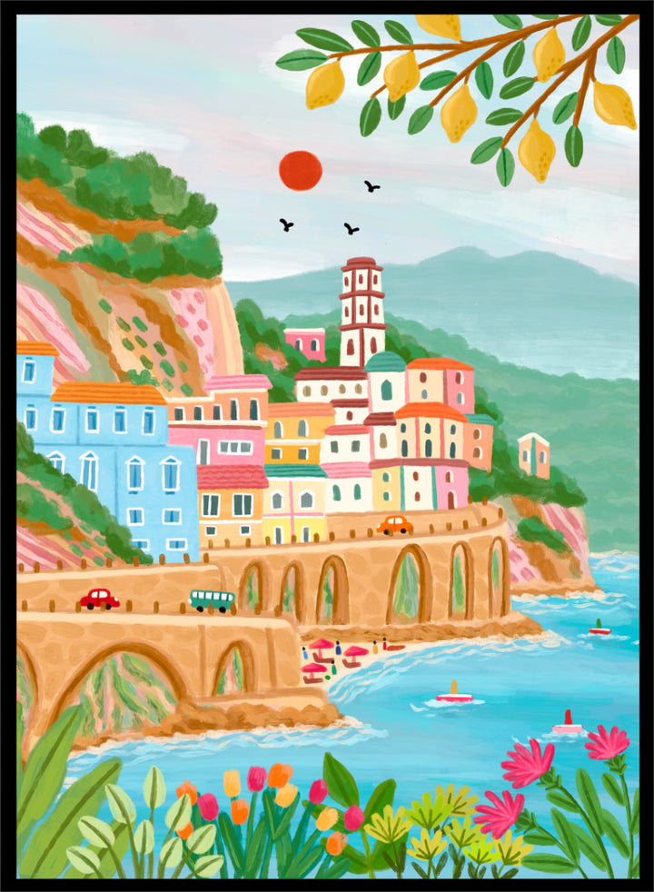 A colorful illustrated coastal town scene with pastel buildings, a stone bridge, blue water, mountains, flowers, and hanging yellow leaves. Shop Colorful Amalfi Coast by Nidhi Kachhadiya, a vibrant Italian coastal wall art print inspired by the Amalfi Coast, pastel villages, blue sea, and lemon trees.