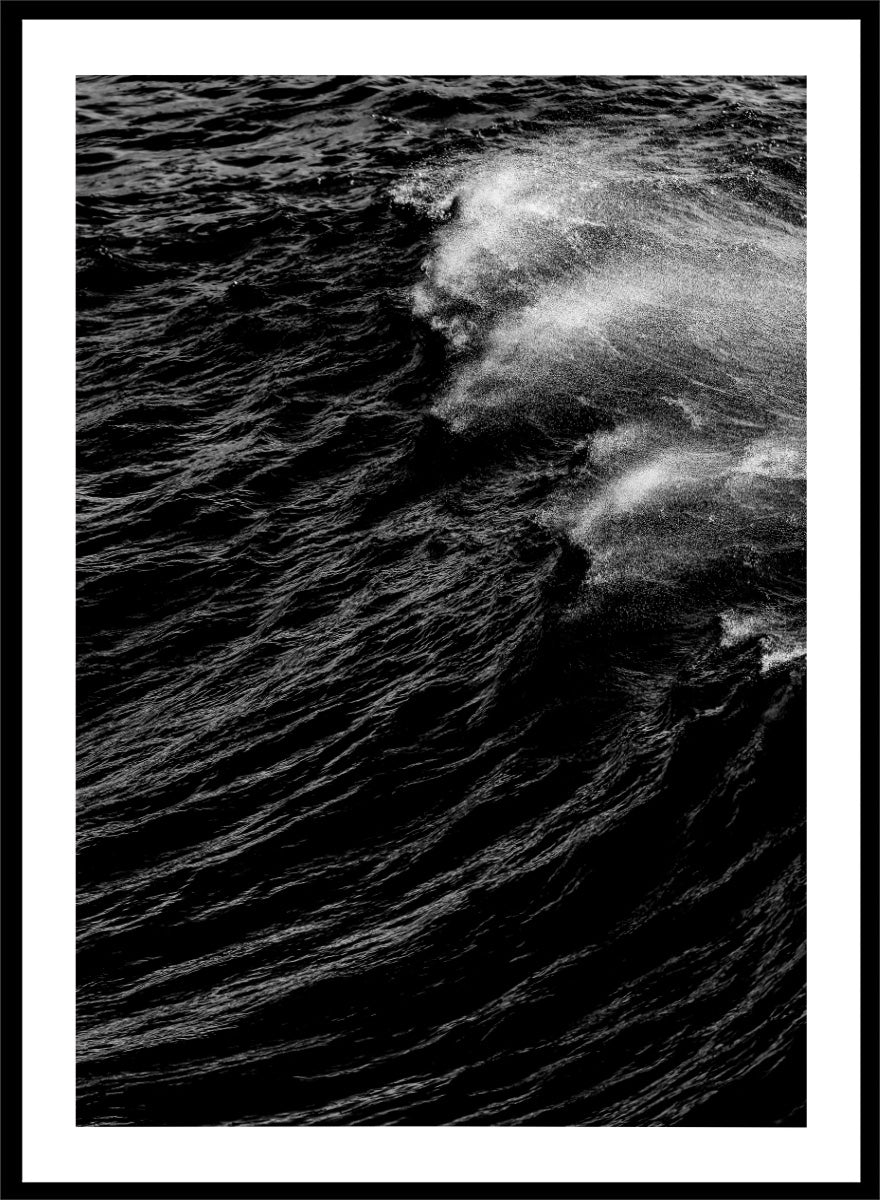 Black and white fine art photographic print of a crashing ocean wave. Dark Wave Symphony by Shot by Clint black-and-white ocean photography print featuring breaking waves, sea spray, and dramatic water texture.