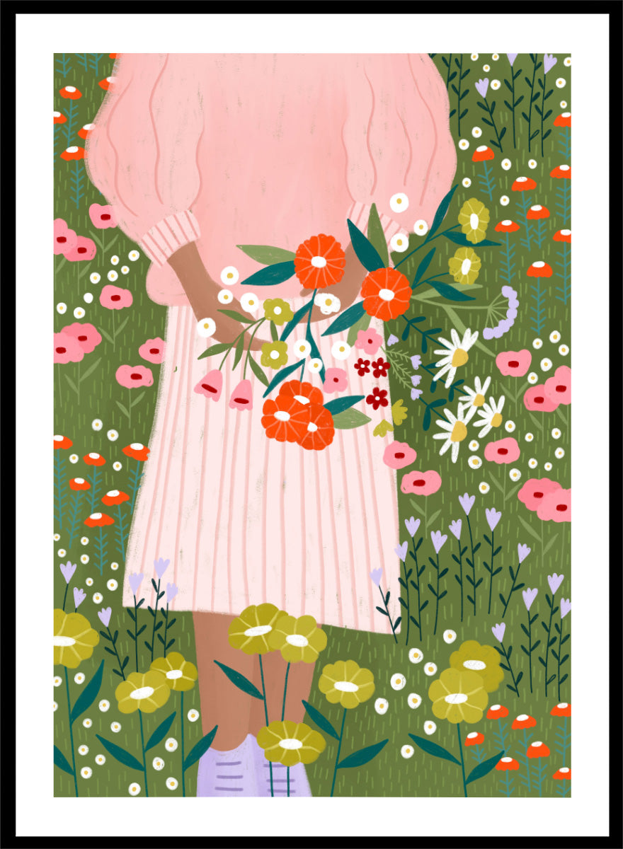 A framed art print featuring a stylized illustration of a person in a pink striped dress holding a bouquet of orange, red, and white flowers in a green field of wildflowers. Secret Garden Bouquet by Bea Müller floral art print featuring a woman gathering wildflowers in a colorful garden filled with poppies, daisies, and greenery.
