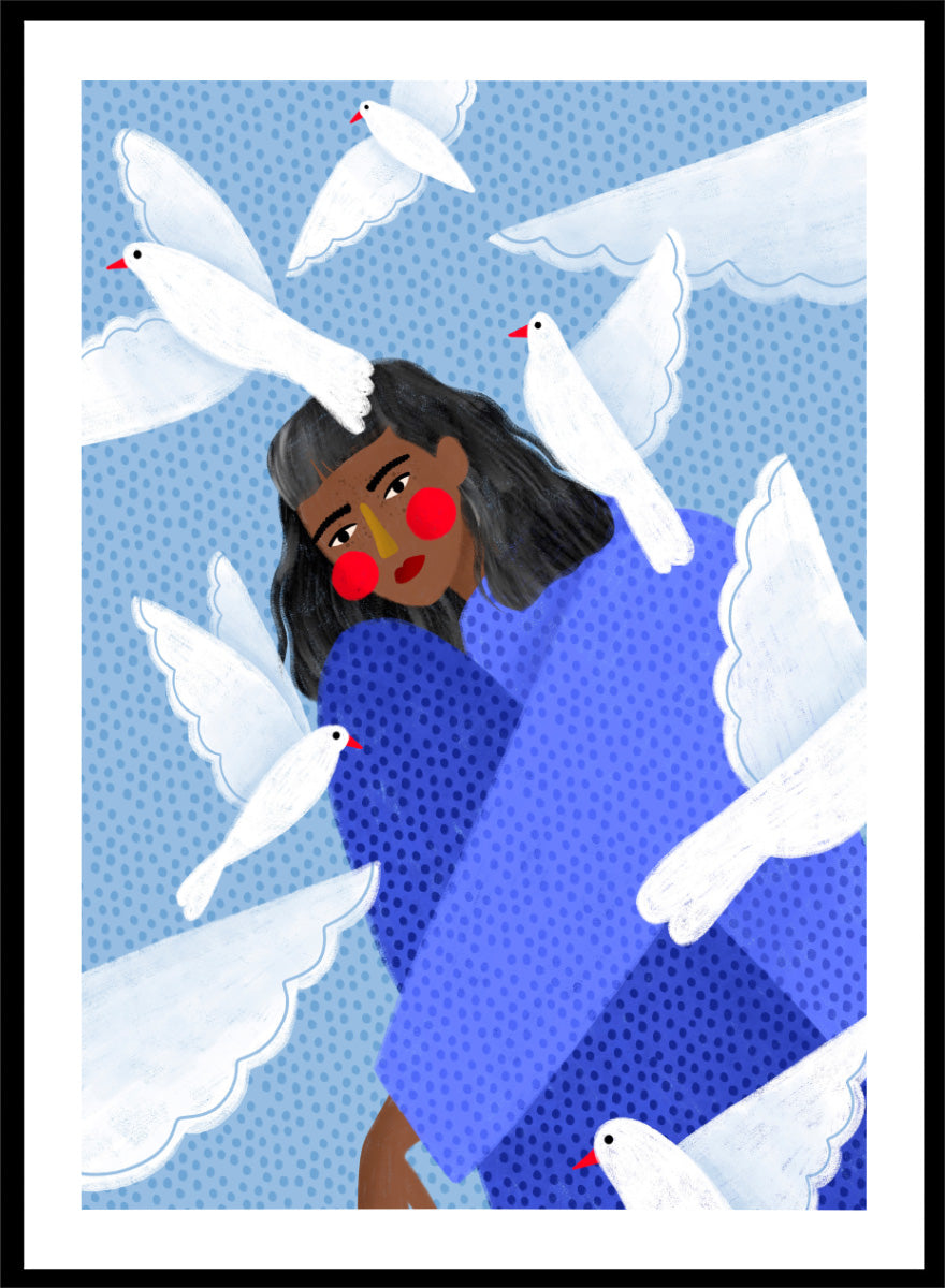 A framed art print featuring a stylized illustration of a woman with dark hair and red cheeks, wrapped in a blue patterned blanket, surrounded by white doves against a light blue dotted background. Peaceful Woman and Doves by Bea Müller art print featuring a woman in blue surrounded by white birds, layered textures, and soft modern color.
