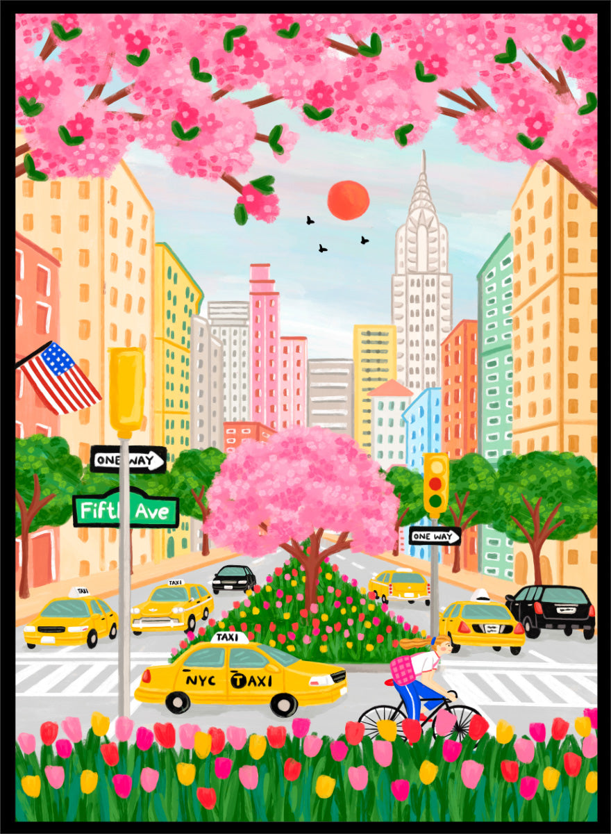 A colorful illustrated city street scene with pink cherry blossoms overhead, yellow NYC taxis, tall buildings, a bicycle with a pink basket, flowers in the foreground, and street signs including Fifti Ave. Shop NYC Cherry Blossoms by Nidhi Kachhadiya, a colorful New York City wall art print with Fifth Avenue, yellow taxis, pink blossoms, and spring city charm.