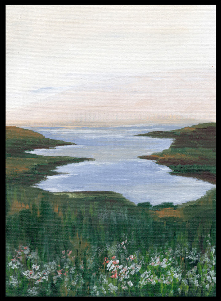 A landscape painting of a winding river or inlet between green hills, with a pale sky above and wildflowers in the foreground. Shop Wildflower Coast View by Nikita Jariwala, a coastal landscape wall art print poster featuring ocean views, green cliffs, wildflowers, and soft blue tones.