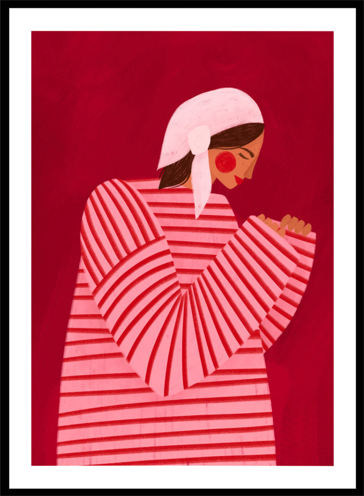 A framed art print featuring a stylized illustration of a woman in a pink and red striped top and white headscarf against a deep red background. Serene Praying Woman by Bea Müller portrait art print featuring a reflective woman in a pink striped dress against a rich red background.