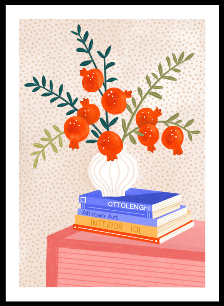 A framed art print featuring a stylized illustration of pomegranate branches in a white vase resting on a stack of books, set against a light beige dotted background. Cozy Tabletop Pomegranates by Bea Müller still life art print featuring red fruit branches, a sculptural vase, design books, and colorful interior styling.