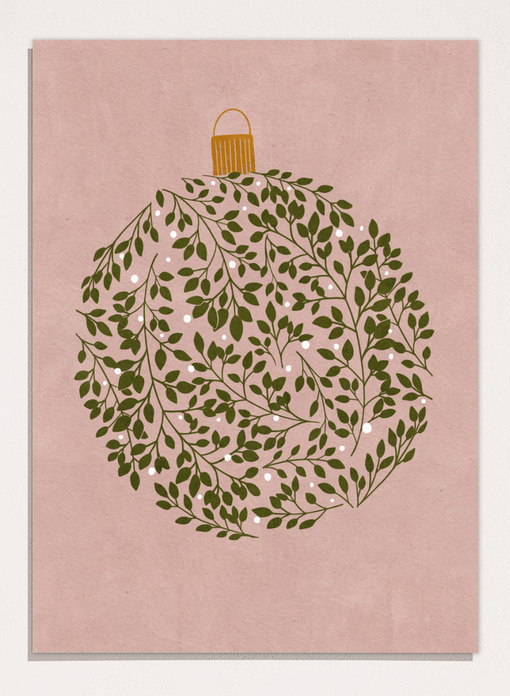Shop Round Ornament by Katie O’Shea, a botanical Christmas wall art print poster featuring green leaves, white glowing light details, and a dusty pink background.