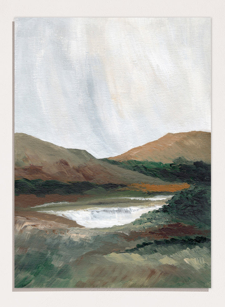 An impressionistic landscape painting of a river or waterfall flowing through a valley, with brown and green hills under a pale sky. Shop Serene Mountain Lake by Nikita Jariwala, a mountain landscape wall art print poster featuring a peaceful lake, wooded hills, and soft green tones.