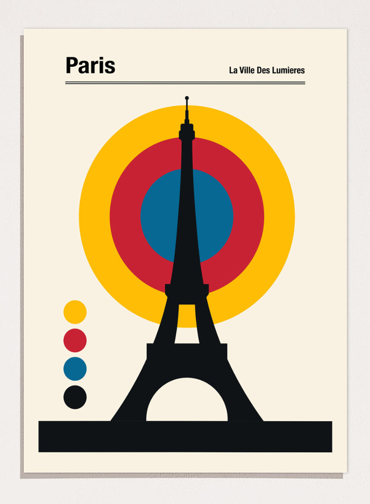 A minimalist Paris poster featuring a black Eiffel Tower silhouette in front of concentric yellow, red, and blue circles on a cream background, with the text &
