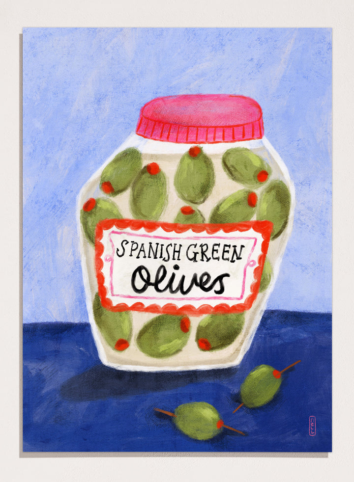 Illustration of a jar of Spanish green olives on a blue background. Spanish Green Olives Jar by Dirkie Nell is a playful food art print featuring hand painted olives, colorful kitchen details, and Mediterranean inspired design.