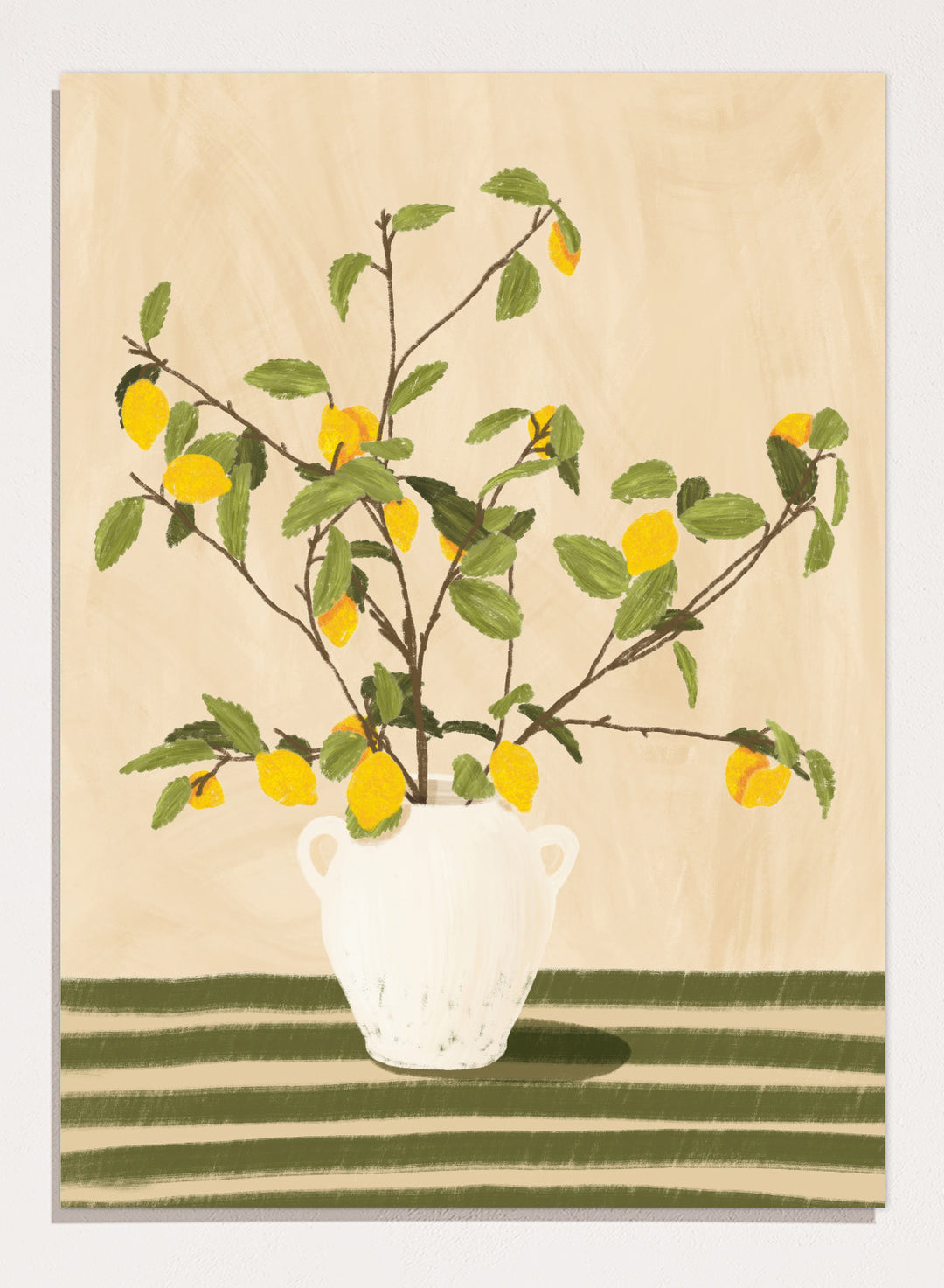 A framed still life artwork showing yellow lemons on leafy branches arranged in a white vase, set against a warm beige background with green horizontal stripes at the bottom. Lemon Tree Still Life by Lisa Solomoniuk premium framed fine art print featuring bright yellow lemons in a white vase on a striped green table.