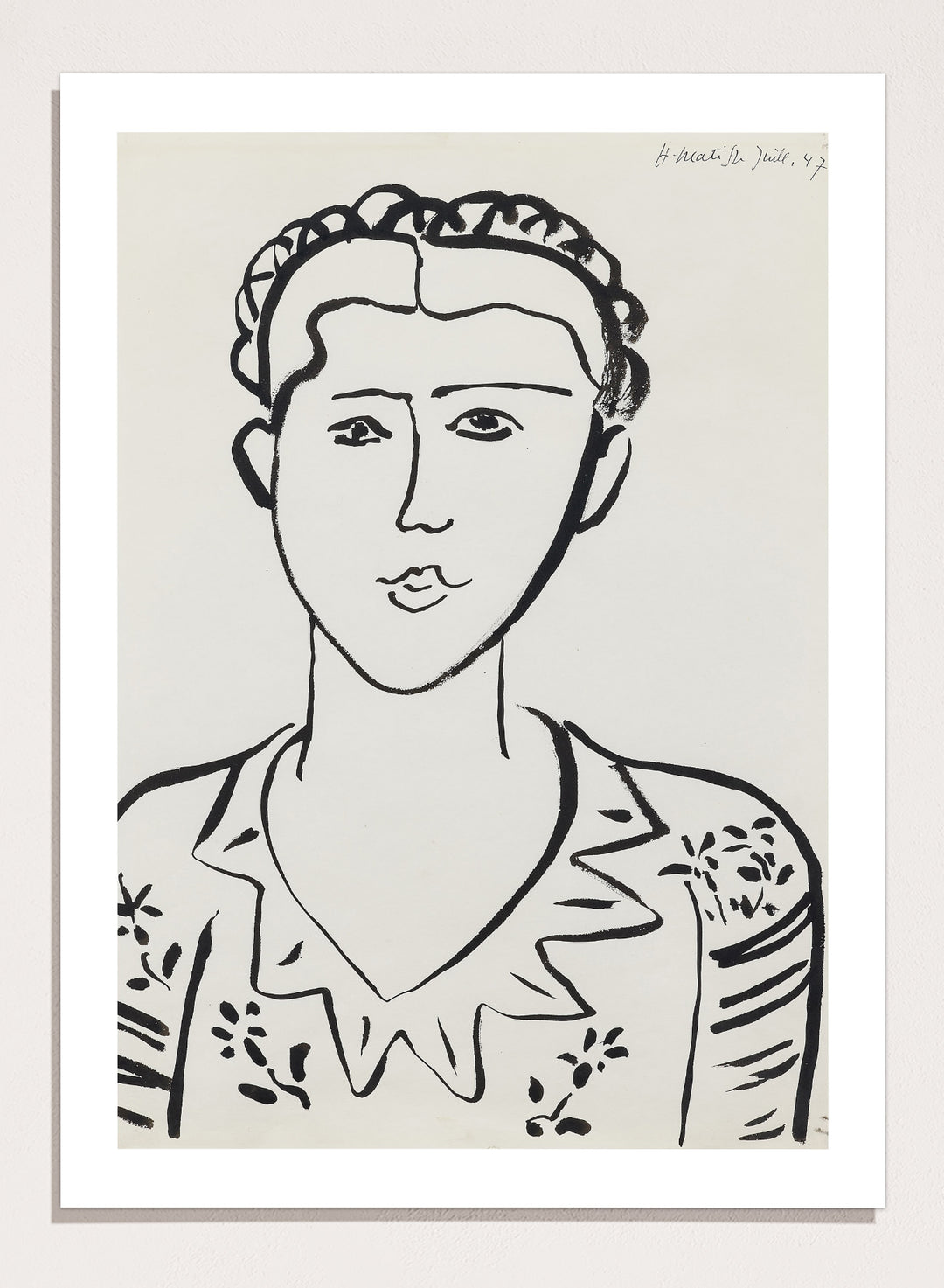 Black line drawing of a woman's portrait on a white background. Portrait de femme by Henri Matisse is a minimalist portrait art print featuring expressive black linework, modern French design, and iconic mid century style.