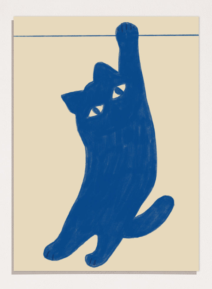 A stylized blue cat silhouette hanging from a thin horizontal line on a warm beige background. Hanging Blue Cat by The Art Concept is a playful cat art print featuring a blue cat dangling from one paw against a warm cream background.