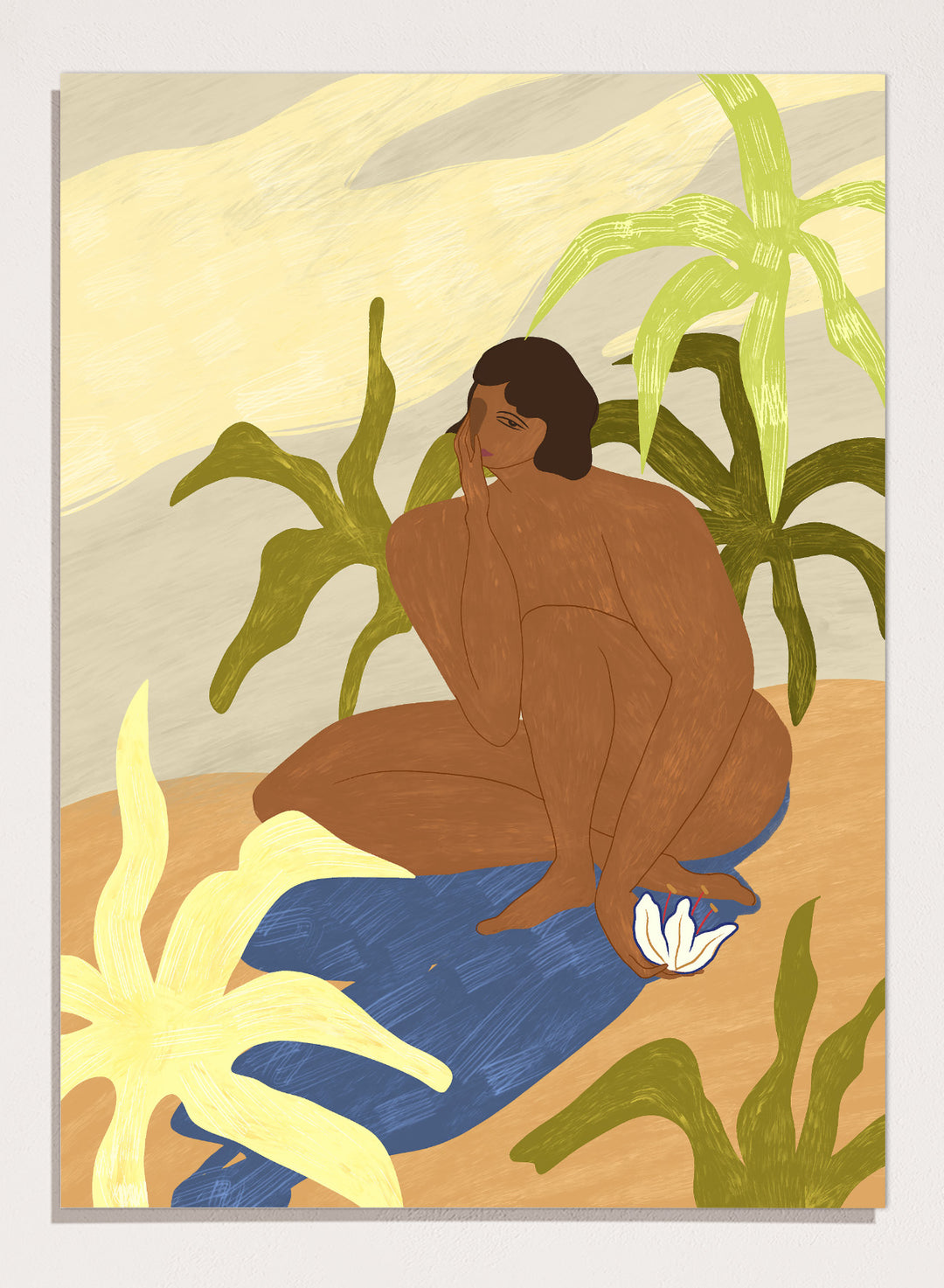 An art print featuring a stylized illustration of a seated figure with dark hair, surrounded by green tropical leaves, a blue cloth, and a white flower, set against a sandy beige and cream background. Au Naturel by Arty Guava premium framed fine art print featuring a seated woman surrounded by oversized tropical plants in warm earthy tones.