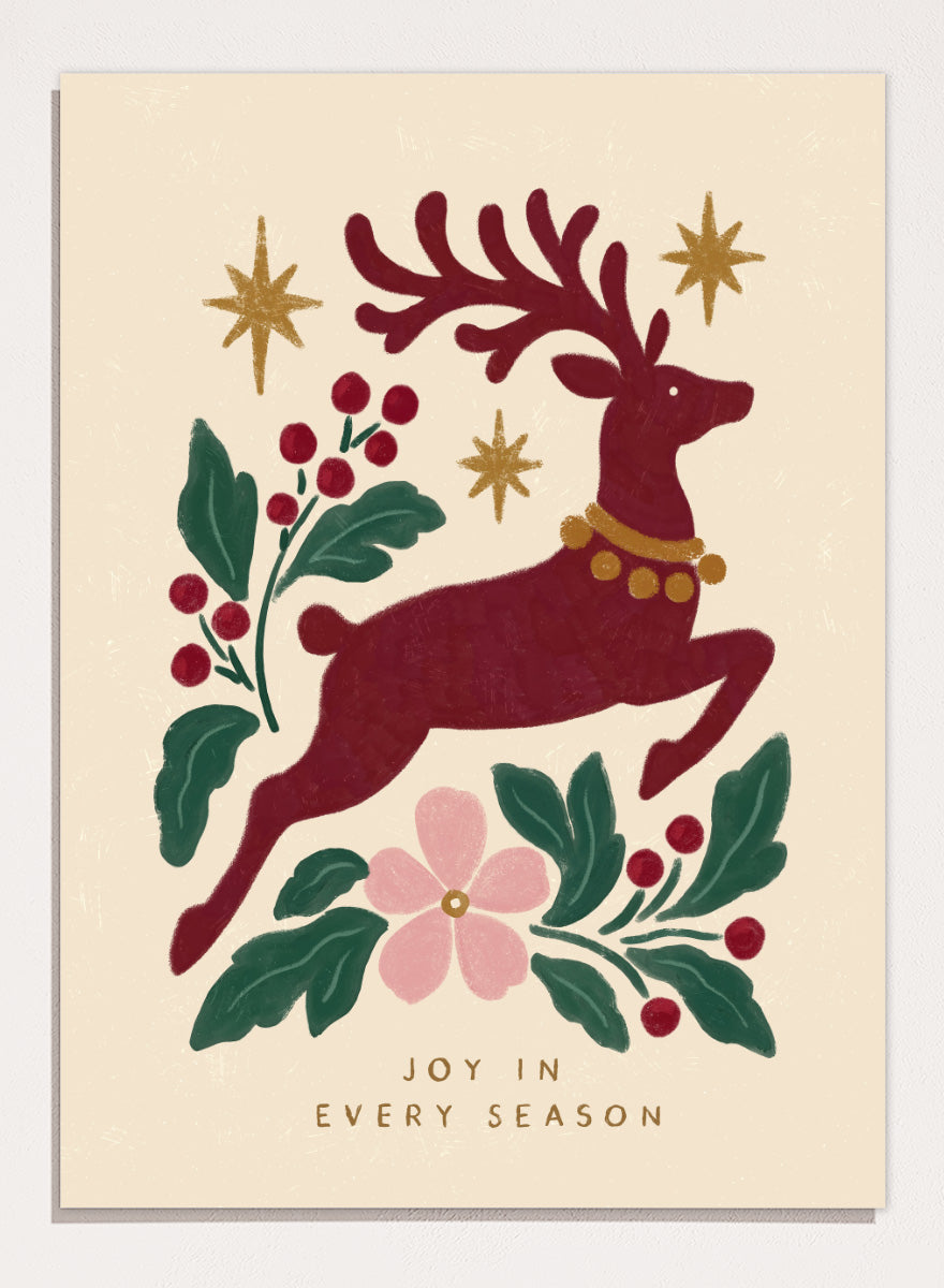 Shop Jumping Reindeer Joy by Katarzyna Gąsiorowska, a Christmas wall art print poster featuring a leaping reindeer, berries, greenery, stars, and festive holiday charm.