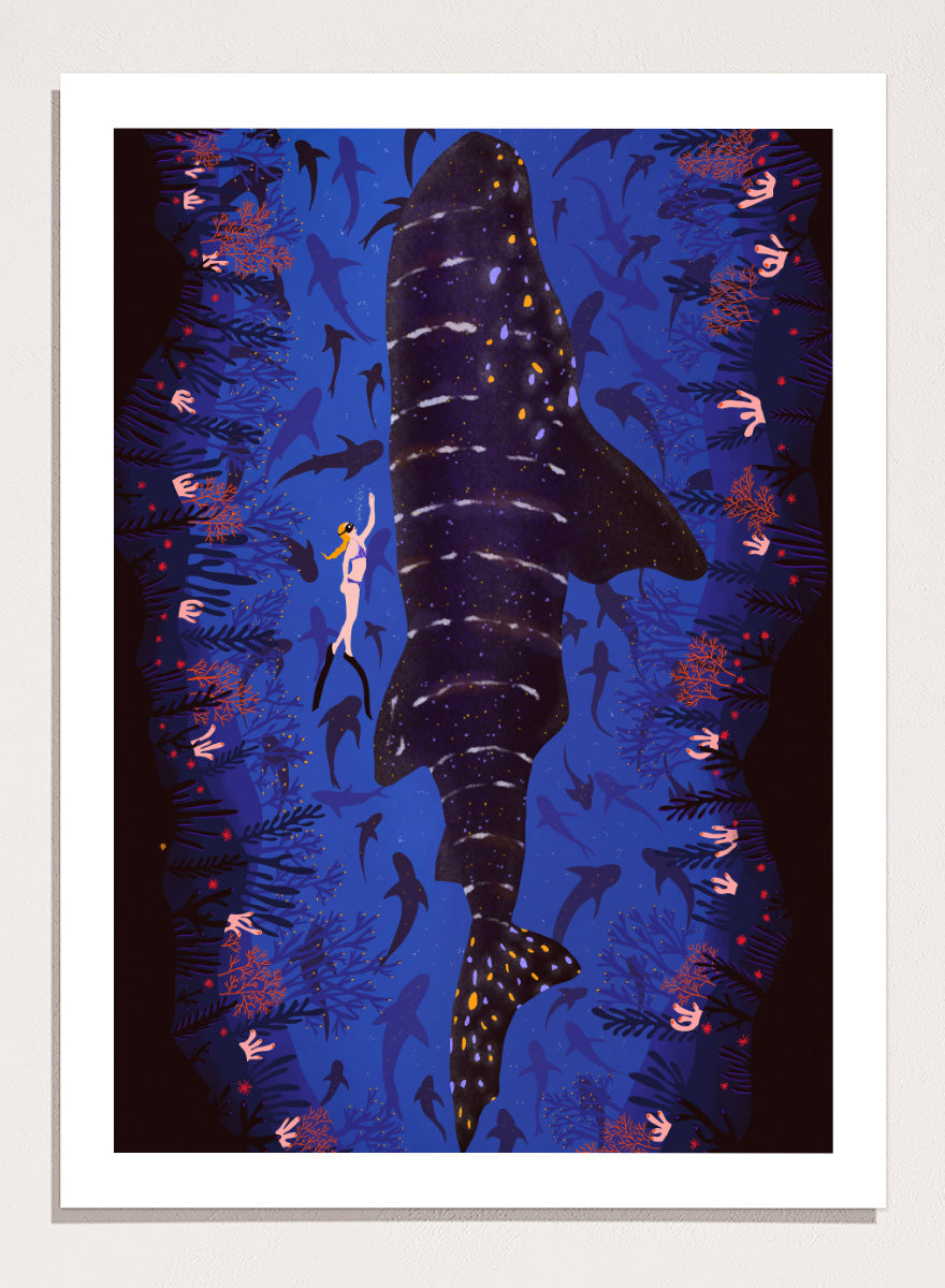 An illustrated art print featuring a large whale shark swimming through a deep blue ocean filled with smaller fish and coral. Diver and Whale Shark art print by Ceyda Alasar features a dramatic underwater view with a whale shark, diver, coral, and rich ocean blues.