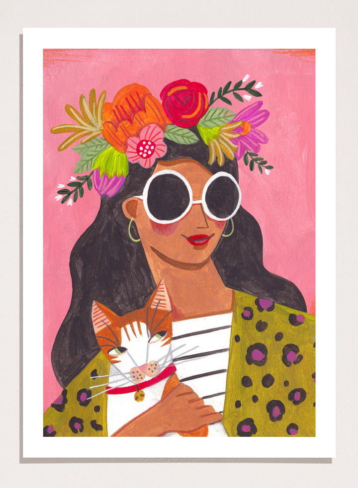 Illustration of a woman with a floral headpiece and sunglasses on a pink background. Cat Lady by Caroline Bonne Müller is a fine art print and wall poster of a woman holding a cat with bold color, floral crown, and modern aesthetic style.