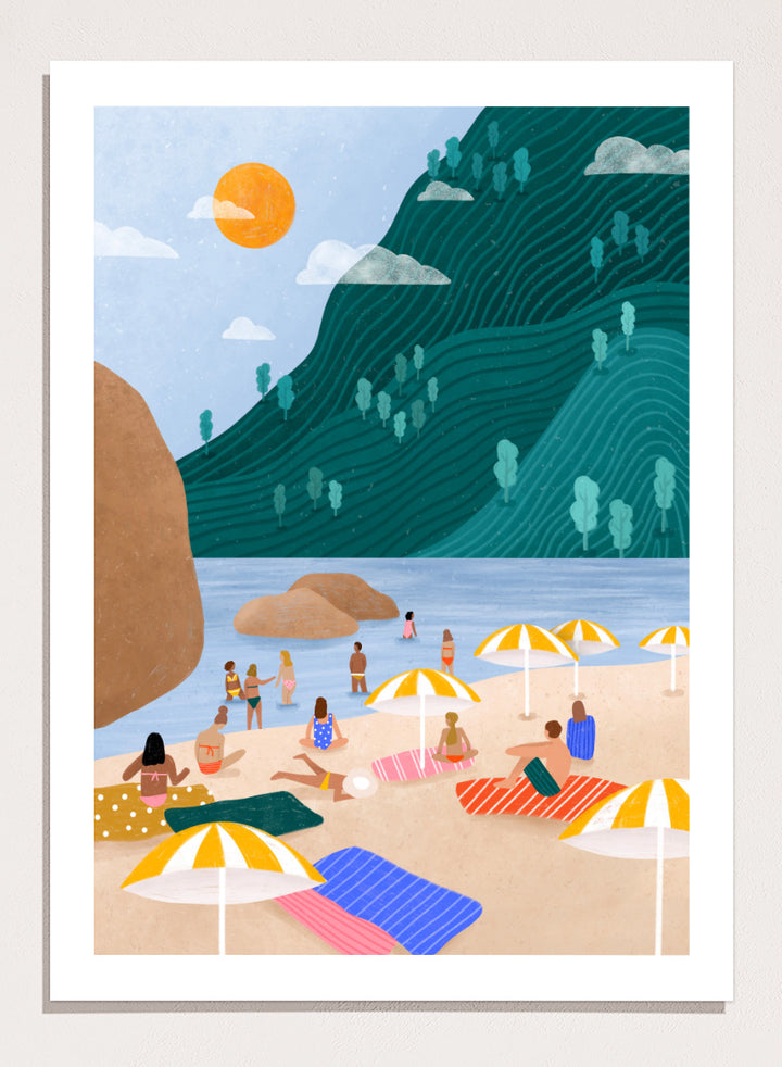 A framed art print featuring a stylized beach scene with a large teal-green mountain, blue water, a yellow sun, and beachgoers under striped umbrellas on a sandy shore. Relaxing Mountain Beach by Bea Müller coastal art print featuring swimmers, striped towels, yellow umbrellas, and a sweeping teal mountain.