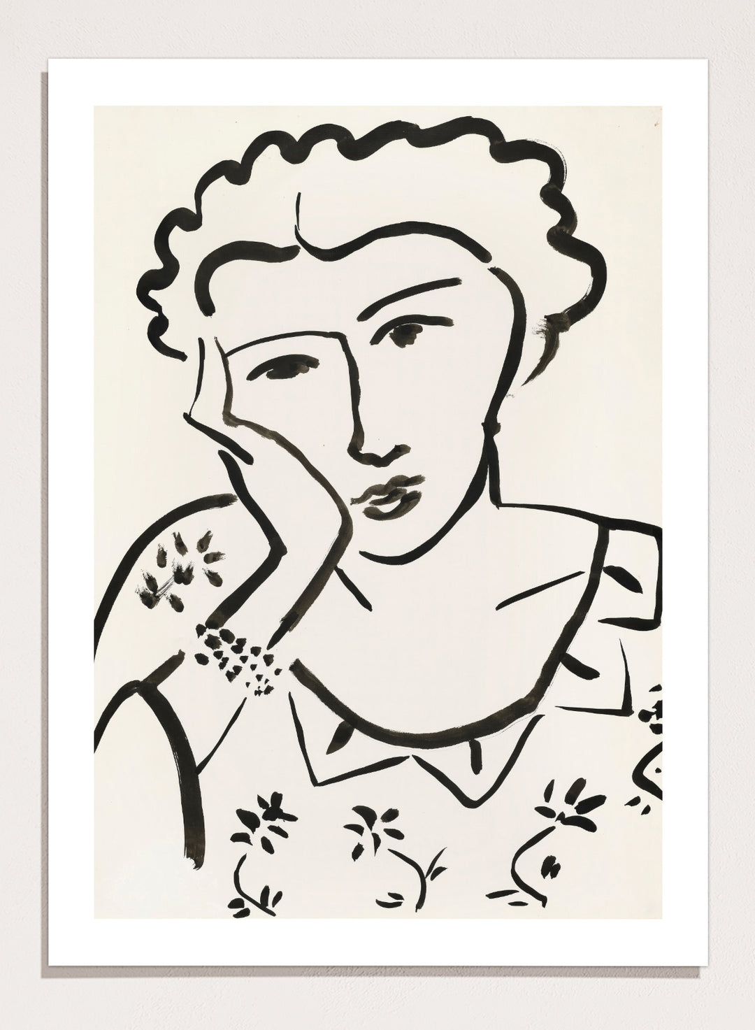 Black line art of a woman with floral patterns on a white background. Jeune Fille Accoudée by Henri Matisse is a minimalist portrait art print featuring expressive black linework, floral detailing, and refined French modernist design.