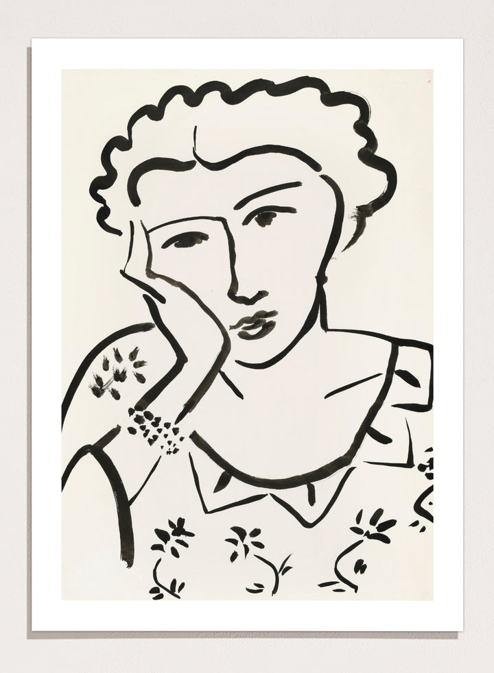 Black line art of a woman with floral patterns on a white background. Jeune Fille Accoudée by Henri Matisse is a minimalist portrait art print featuring expressive black linework, floral detailing, and refined French modernist design.