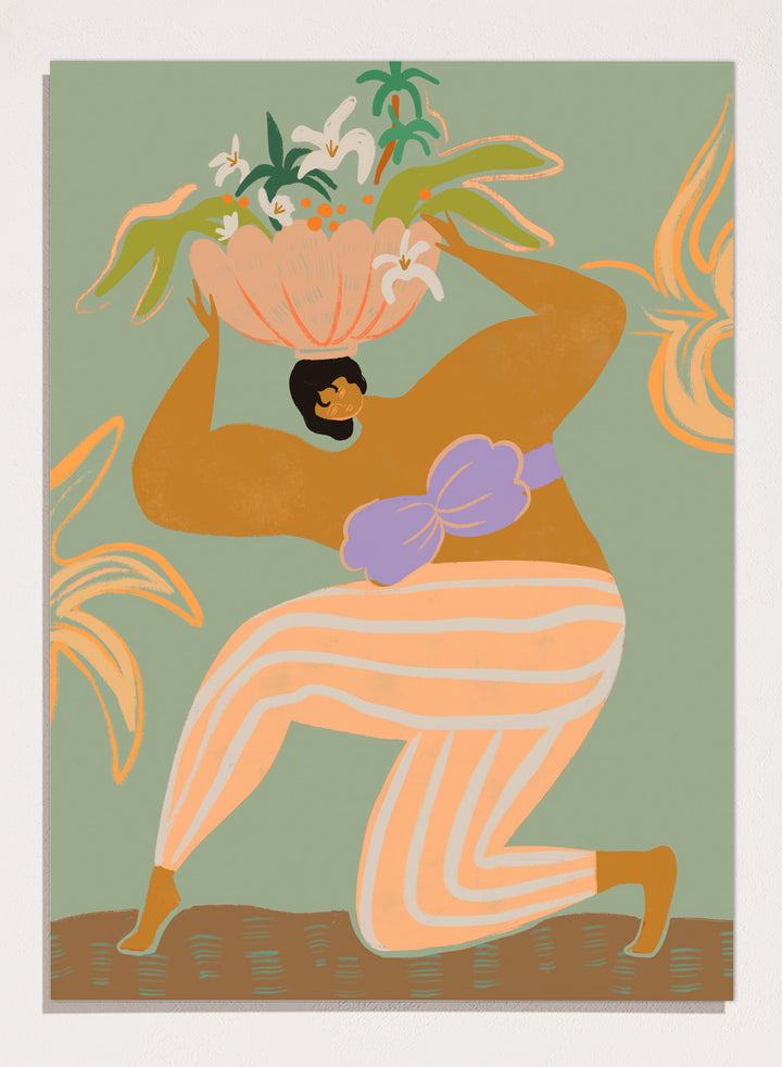 A stylized art print featuring a woman in flowing peach and white striped pants with a purple sash, carrying a large flower basket on her head against a muted sage green background. The Weight of the World by Arty Guava premium framed fine art print featuring a woman carrying tropical flowers in soft green, peach, and lilac tones.