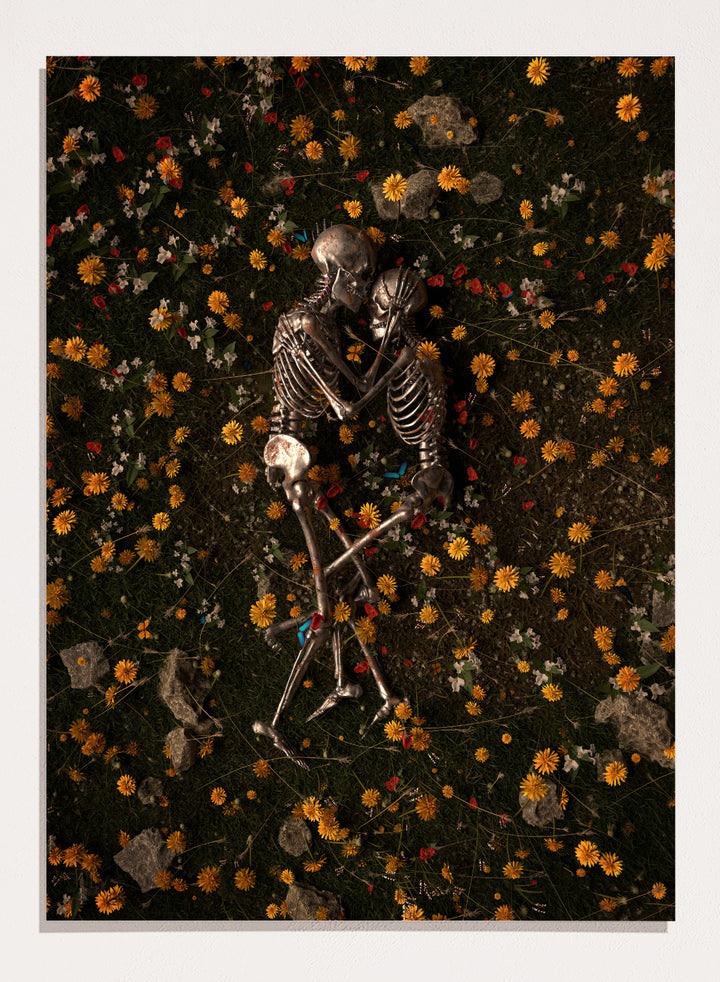 Skeletons In Love by Nicebleed is a surreal skeleton couple art print featuring intertwined skeletons in a floral field, modern aesthetic wall poster.