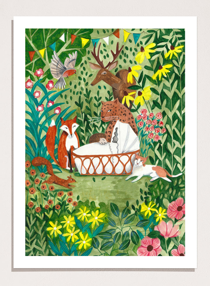 A framed art print featuring a whimsical forest illustration with animals gathered around a basket, surrounded by flowers and foliage. The print is shown with a white mat and a black frame against a white background. Welcome to the Forest by Caroline Bonne Müller woodland animal art print featuring a baby surrounded by a leopard, fox, deer, cat, flowers, and forest life.