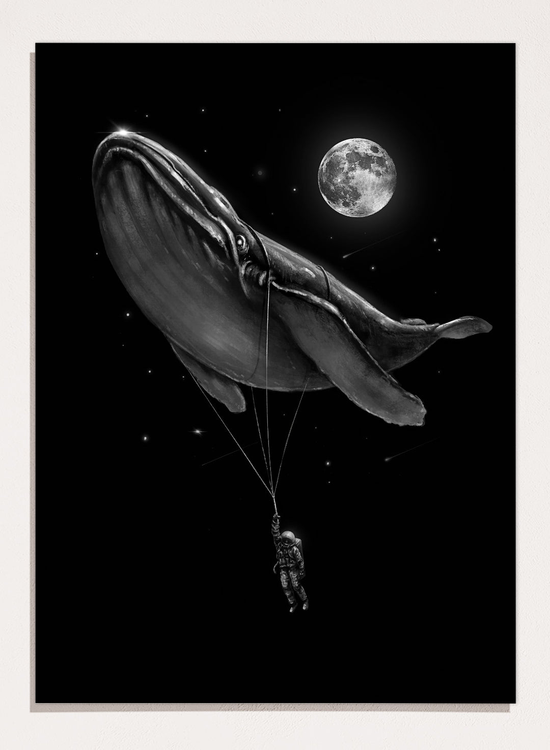 Black and white illustration of a large whale balloon with a person attached, set against a starry night sky with a moon. Cosmic Whale Ride by Nicebleed is a surreal space art print featuring an astronaut hanging from a floating whale, modern aesthetic wall poster.