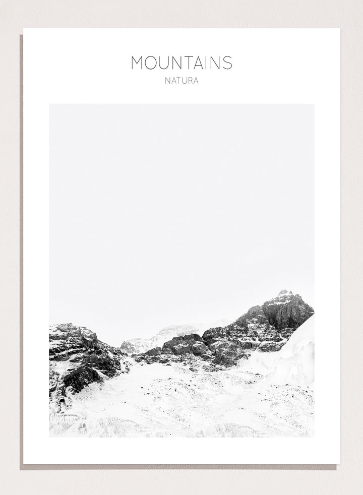 Black and white mountain landscape with 'Mountains Natura' text. Serene Peaks by The MIUUS Studio is a black and white mountain photography art print and wall poster featuring snowy peaks, minimalist composition, and modern neutral design.