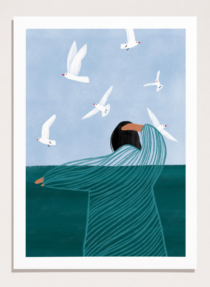 Seaside Serenity by Bea Müller is an officially licensed art print featuring a calm seaside figure and flying birds. Available as fine art print or framed with real wood frames.