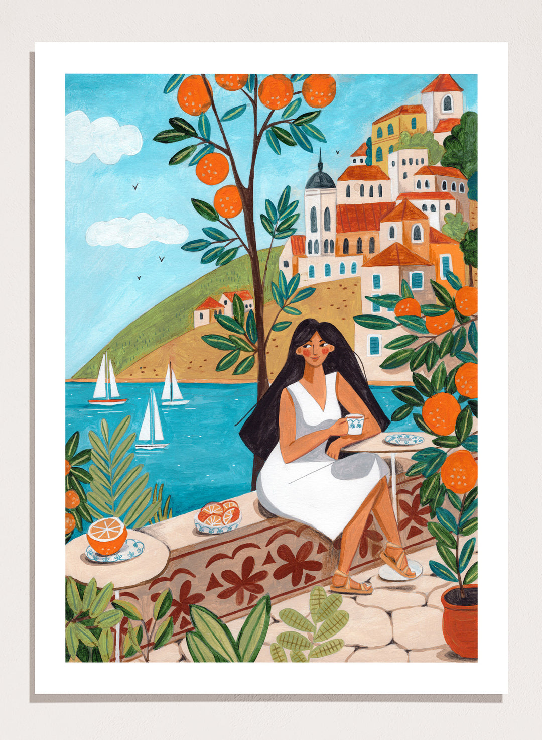 Woman in a white dress sitting under an orange tree with a scenic coastal town in the background. Mediterranean Orange Grove View by Caroline Bonne Müller fine art print, wall art poster with coastal scene, orange trees, modern aesthetic design