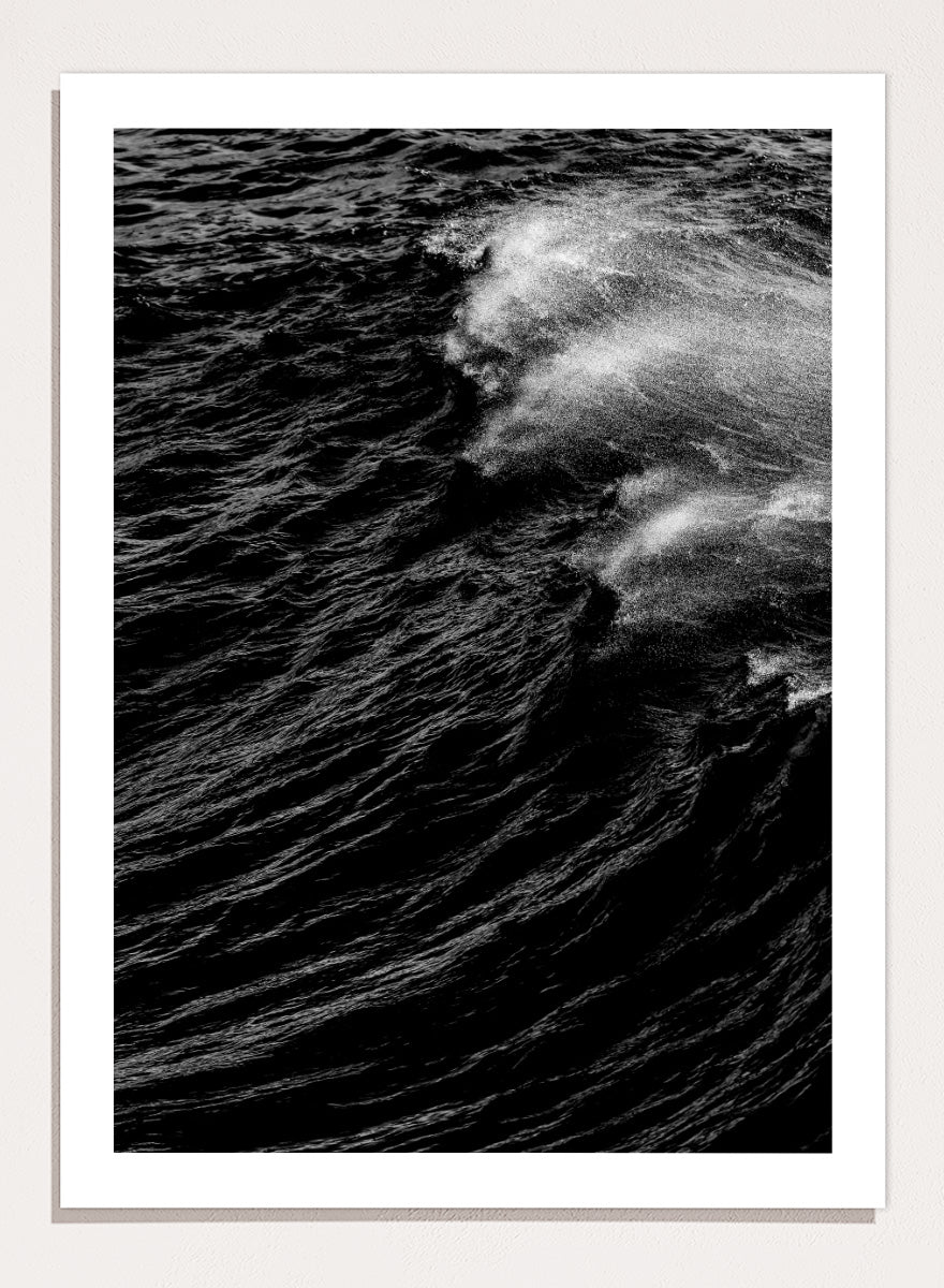 Black and white fine art photographic print of a crashing ocean wave. Dark Wave Symphony by Shot by Clint black-and-white ocean photography print featuring breaking waves, sea spray, and dramatic water texture.