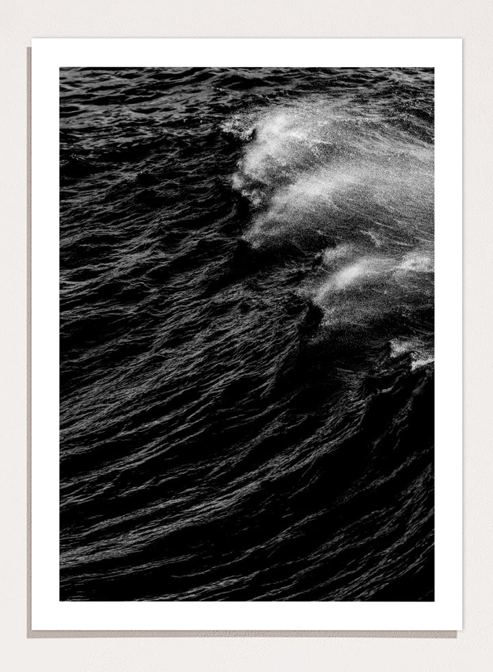 Black and white fine art photographic print of a crashing ocean wave. Dark Wave Symphony by Shot by Clint black-and-white ocean photography print featuring breaking waves, sea spray, and dramatic water texture.