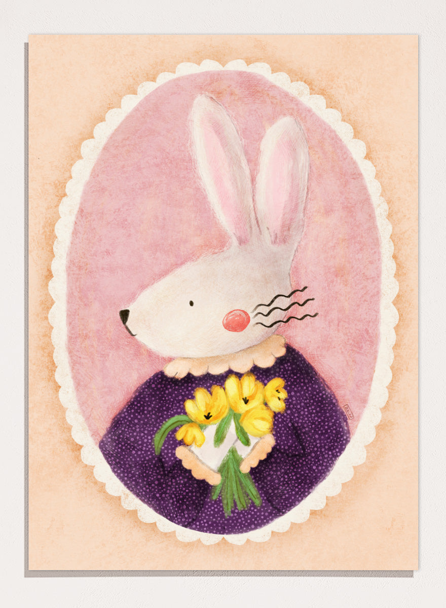 A framed art print featuring a whimsical illustration of a white rabbit in a purple dress holding yellow flowers, set against a pink oval background. Shop Charming Bunny With Tulips by Dirkie Nell, a playful animal portrait art print featuring a white bunny, yellow tulips, purple dress, and soft pink tones.