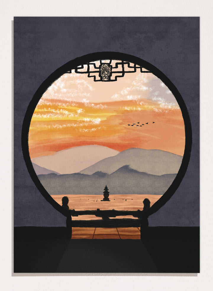 A framed art print depicting a scenic landscape viewed through a circular window frame. The scene shows layered mountains under a warm orange and yellow sunset sky with a small pagoda-like structure and birds, set against a dark gray background. Asian Pagoda Sunset View by Lisa Solomoniuk premium framed fine art print featuring layered mountains, a distant pagoda, and a glowing peach sunset.