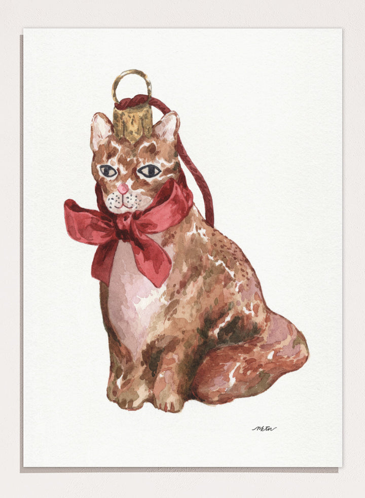 Shop Charming Cat Ornament by NKTN, a festive cat wall art print poster featuring a brown tabby with an oversized red bow and watercolor holiday style.