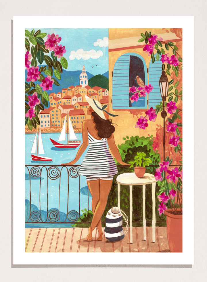 Woman on a balcony overlooking a coastal town with boats and flowers. Woman Balcony Coastal View by Caroline Bonne Müller is a fine art print and wall poster of a woman overlooking a coastal town with boats in a modern aesthetic style.