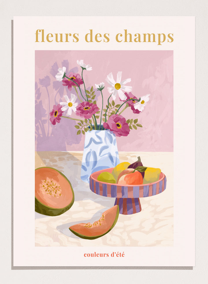 Illustration of a vase with flowers and fruits on a table against a pink background, with text 'fleurs des champs' and 'couleurs d'ete'. Fleur Des Champs Pink by Goed Blauw is a colorful still life art print and wall poster featuring flowers, fruit, and a patterned vase in a modern composition.