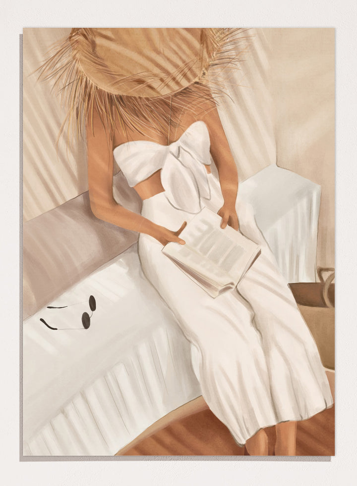 Woman in a white dress holding a clutch, sitting on a couch with a neutral background. Chic Summer Reading by City Art features a woman reading in a sunlit bedroom, bringing warm neutrals, relaxed interiors, and organic summer style home.
