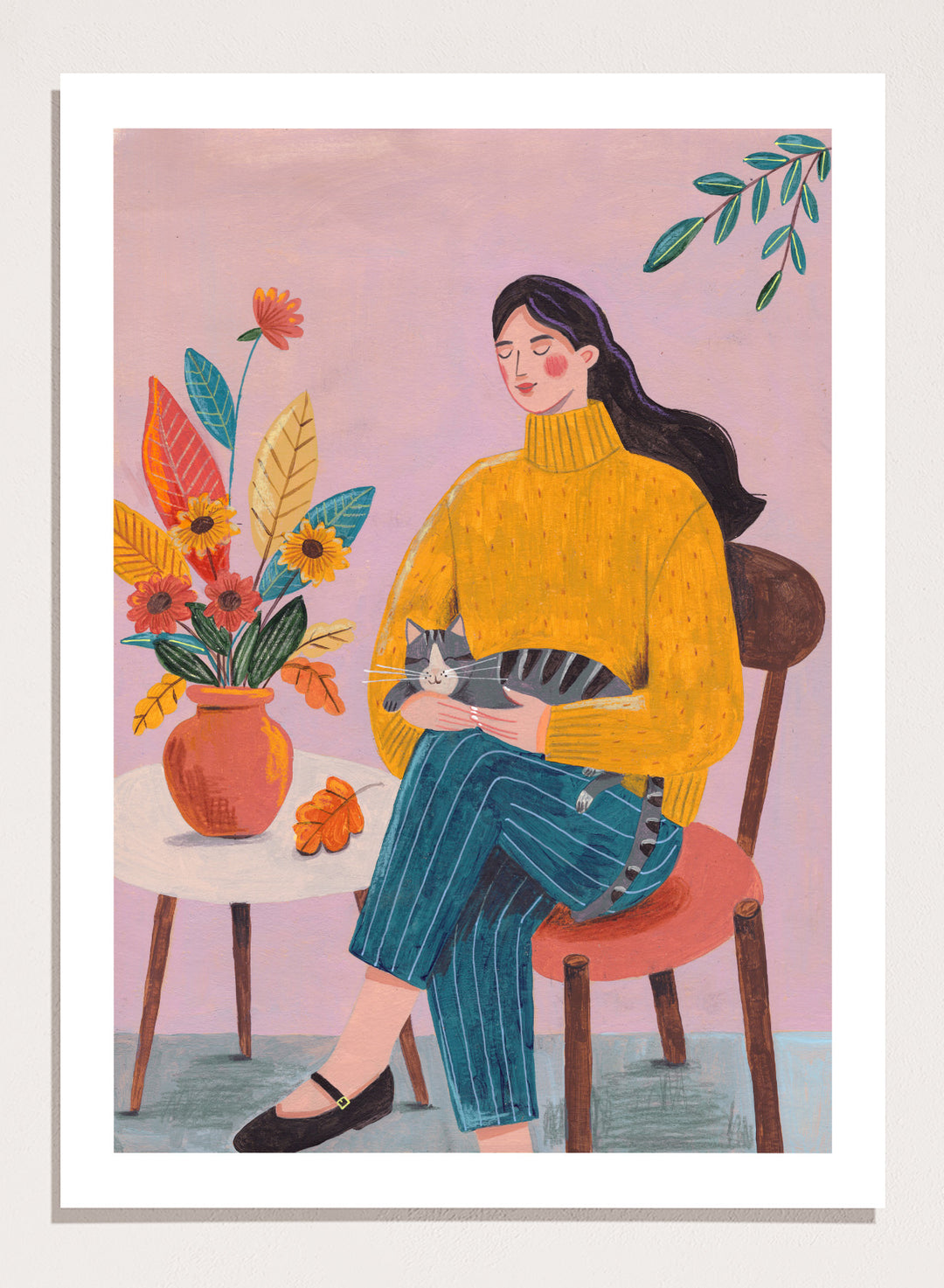 Illustration of a woman in a yellow sweater holding a cat, sitting by a table with flowers on a pink background. Peaceful Woman and Cat by Caroline Bonne Müller is a fine art print and wall poster featuring a woman holding a cat beside a floral arrangement.