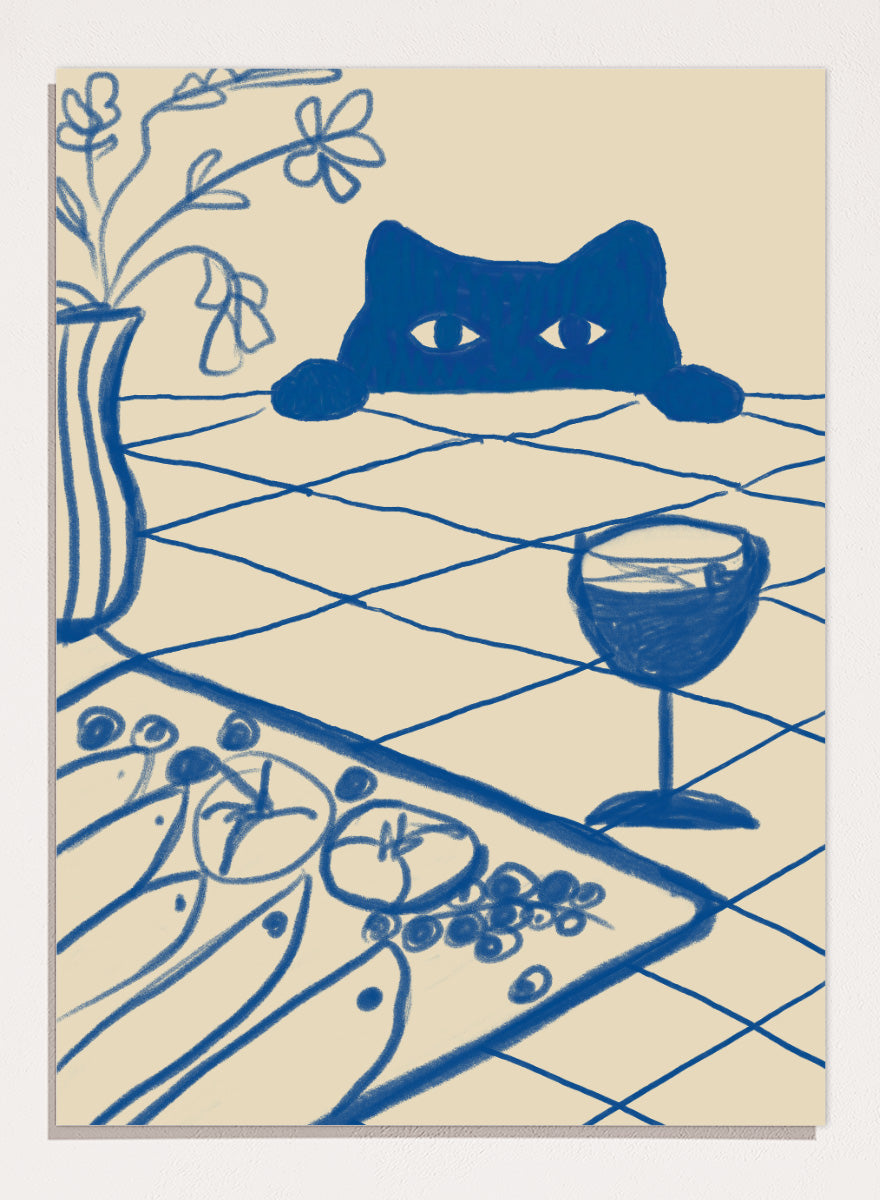 A stylized blue line-art illustration of a cat peeking over a table with a wine glass, flowers, and food, rendered in a cream background. Curious Blue Cat Dinner by The Art Concept is a playful cat art print featuring a peeking blue cat, table setting, flowers, and bold linework.