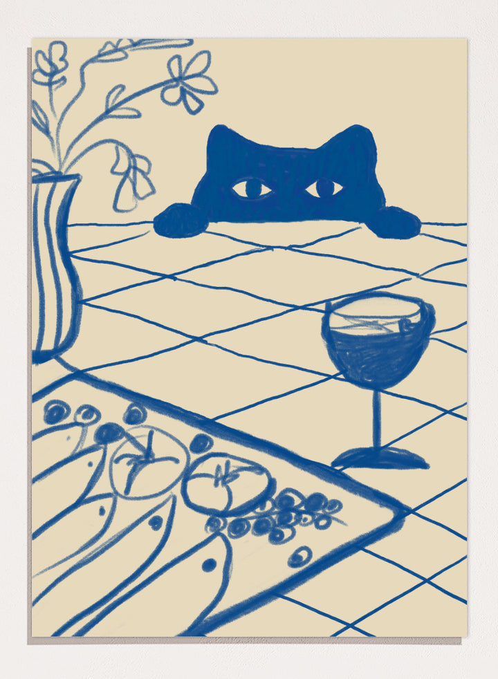 A stylized blue line-art illustration of a cat peeking over a table with a wine glass, flowers, and food, rendered in a cream background. Curious Blue Cat Dinner by The Art Concept is a playful cat art print featuring a peeking blue cat, table setting, flowers, and bold linework.