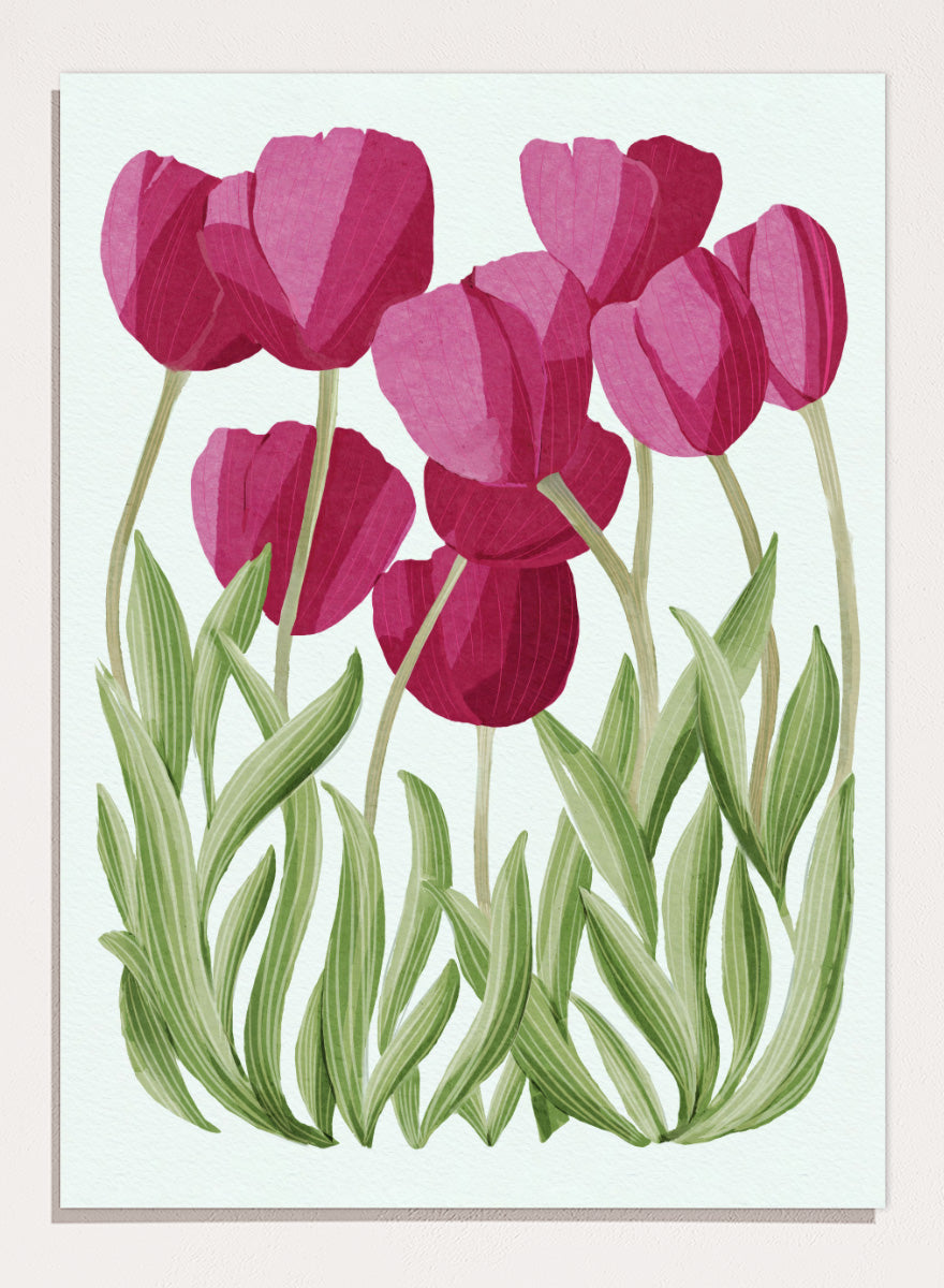 A stylized floral illustration of pink tulips with green leaves on a white background. Shop Tulips Floral Art Print by Katie O&