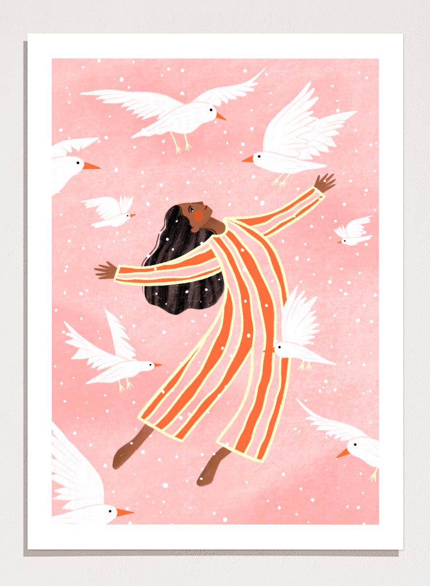 A framed art print featuring an illustration of a woman in orange and white striped pajamas floating among white doves on a soft pink background. Joyful Liberation by Bea Müller woman art print featuring a free-spirited figure surrounded by white birds in bold pink and orange tones.