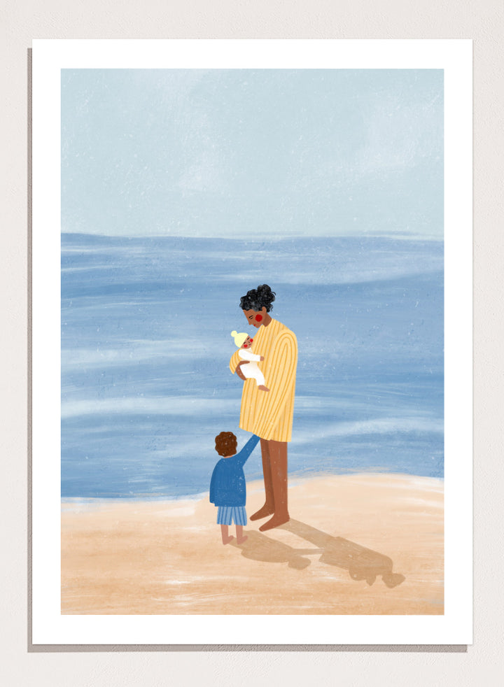 A framed art print featuring an illustration of a man in a yellow striped shirt holding a white dog on a beach next to a child in a blue coat, set against a light blue ocean and pale sky. Family Beach Day by Bea Müller art print featuring a mother with her baby and young child by the sea, created for warm family and coastal decor.